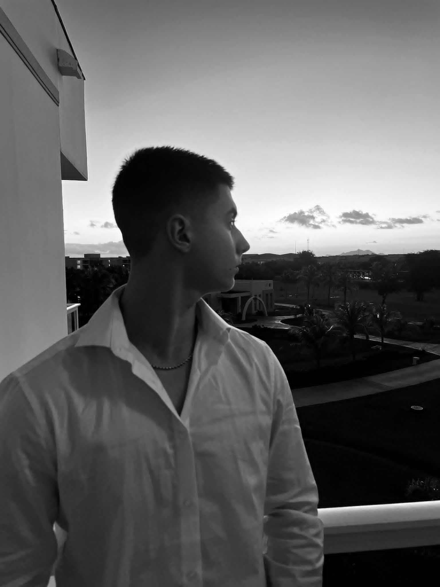 NOMAD co-founder looking beautiful sunset, black and white picture taken from a cellphone. Redefine your hydration with NOMAD