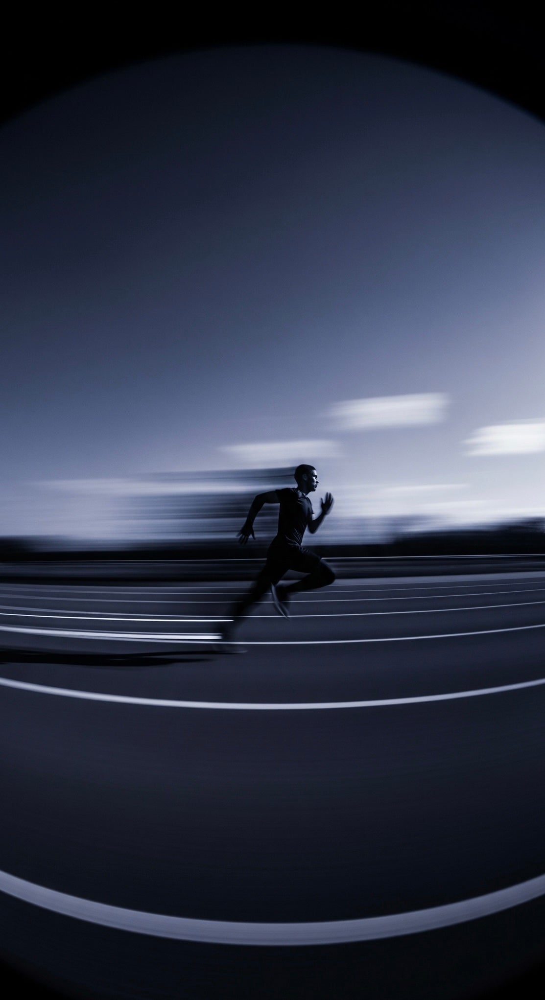 Person running at at a marathon with a SafeSip water bottle. Using a fish-eye lens catching at a high speed