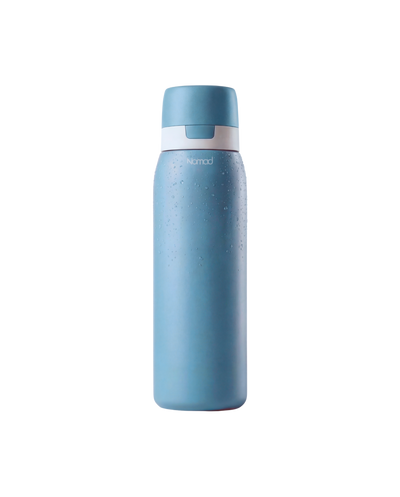 NOMAD Blue water bottle with a filtration system inside 
