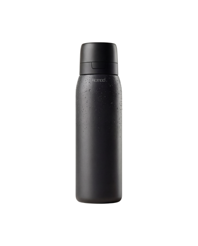 Green forest nomad filtered bottle on a white background 